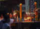 Thailand Phuket Veg Fest shrine with bright candles.jpg (22635 bytes)
